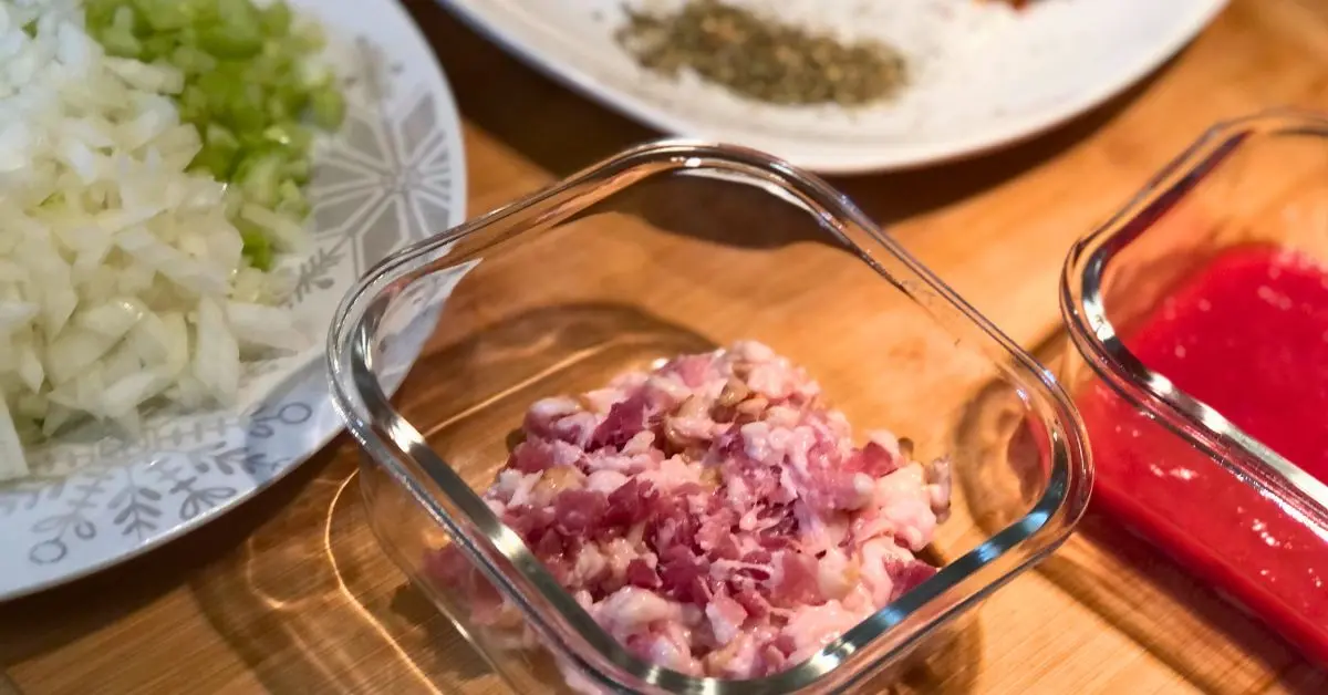 chopped raw back on a cutting board with veggies