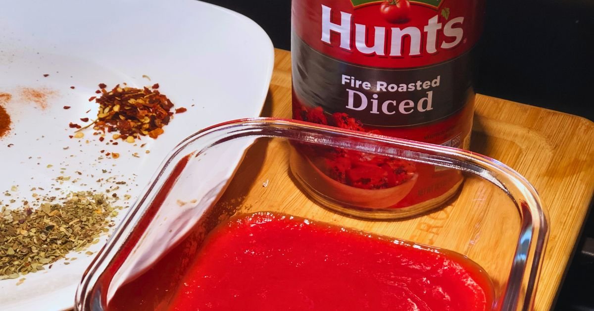 can of fire roasted diced tomatoes and crushed tomatoes in a glass container