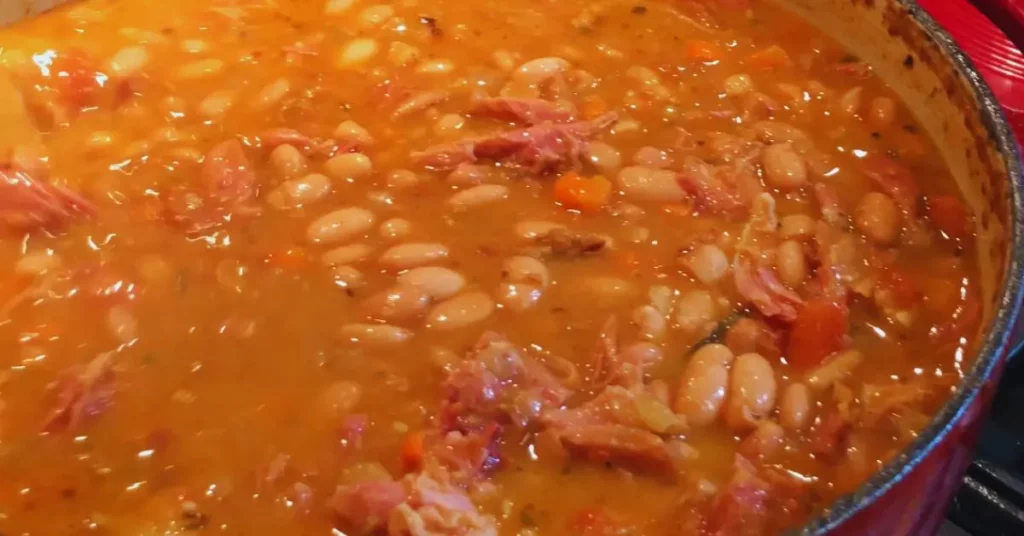 Big pot of Italian Bean Stew with ham and carrots.