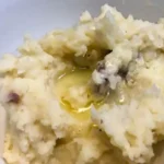 Rustic red skinned mashed potatoes with creamy texture and potato skin
