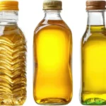 Assorted cooking oils in different colors on a white background for culinary use
