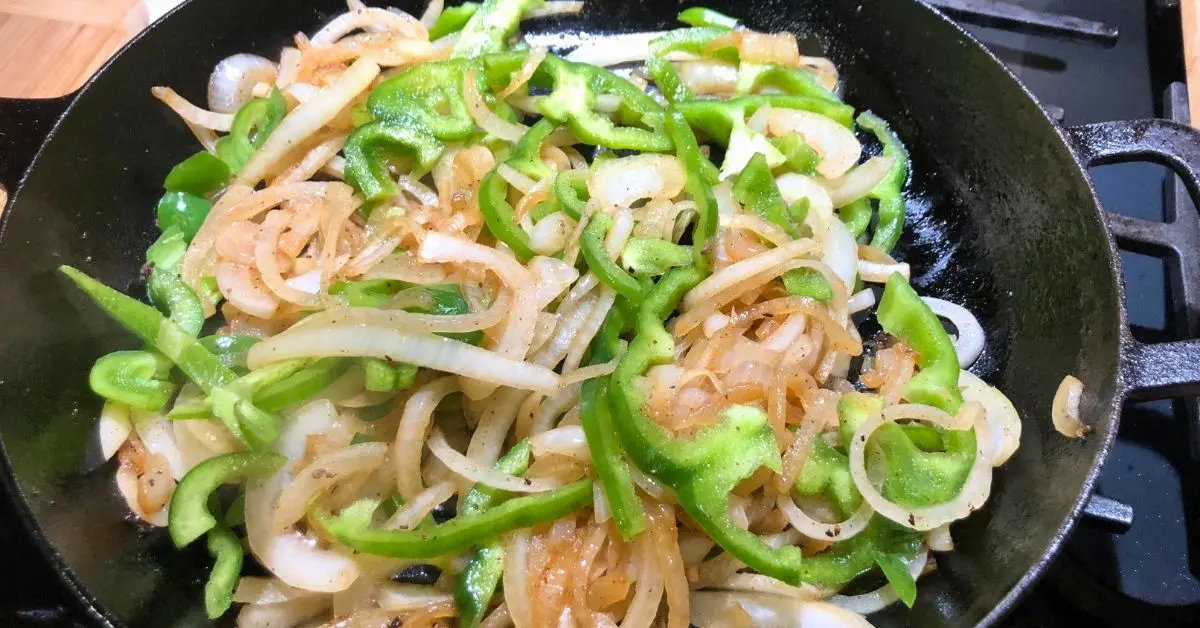 Onions and green peppers cooking for Salisbury steak gravy