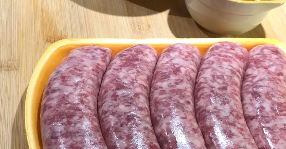 Raw bratwurst sausages in their package before preparing beanie weenies